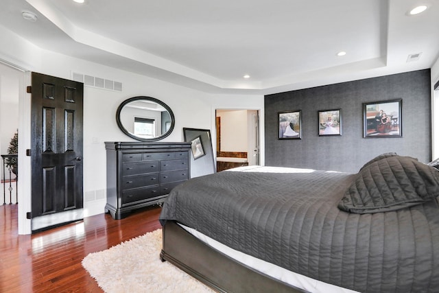 28 Viola Ct, Wappingers Falls, NY 12590 - bedroom with a raised ceiling, wood finished floors, recessed lighting, and an accent wall