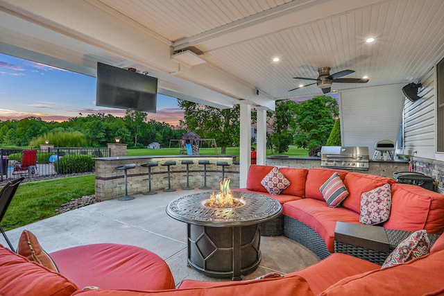 28 Viola Ct, Wappingers Falls, NY 12590 - view of patio / terrace featuring an outdoor living space with a fire pit, exterior kitchen, a ceiling fan, and a playground