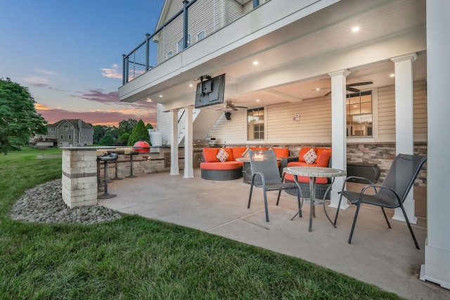 28 Viola Ct, Wappingers Falls, NY 12590 - patio terrace at dusk with a balcony, a ceiling fan, a patio, and outdoor lounge area