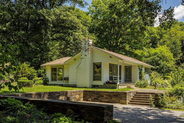 447 Butts Hollow Rd, Dover Plains, NY 12522 - view of front of property with a chimney, a porch, and a shingled roof