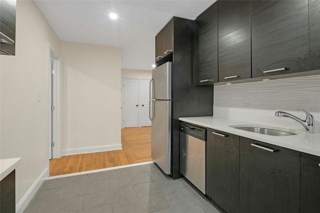 445 W 240th St Unit 4C, Bronx, NY 10463 - kitchen with appliances with stainless steel finishes, light countertops, light tile patterned floors, and modern cabinets