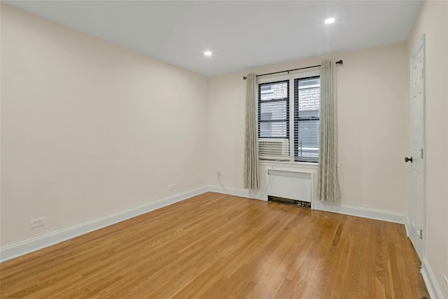 445 W 240th St Unit 4C, Bronx, NY 10463 - empty room with radiator, light wood-type flooring, and recessed lighting