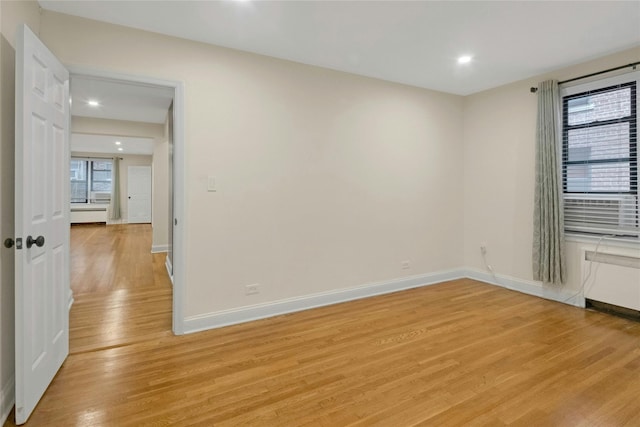 445 W 240th St Unit 4C, Bronx, NY 10463 - spare room featuring light wood-style floors, recessed lighting, and radiator