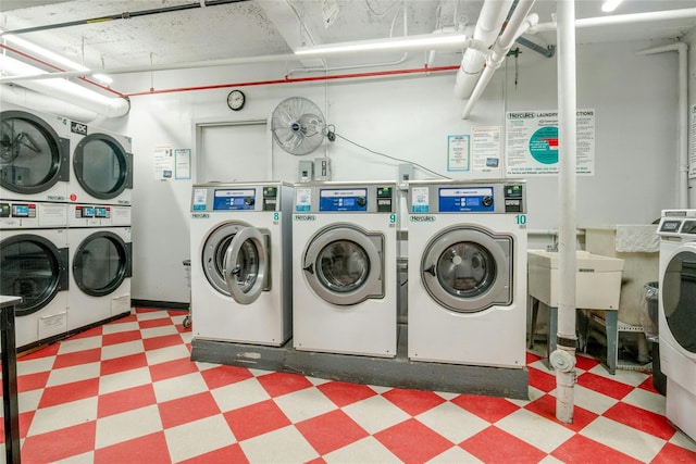 445 W 240th St Unit 4C, Bronx, NY 10463 - communal laundry room featuring tile patterned floors, separate washer and dryer, and stacked washing machine and dryer