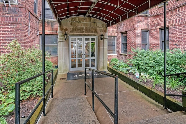 445 W 240th St Unit 4C, Bronx, NY 10463 - doorway to property with french doors and brick siding