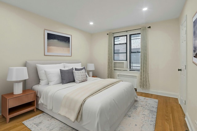 445 W 240th St Unit 4C, Bronx, NY 10463 - bedroom featuring light wood-style floors, recessed lighting, and radiator heating unit