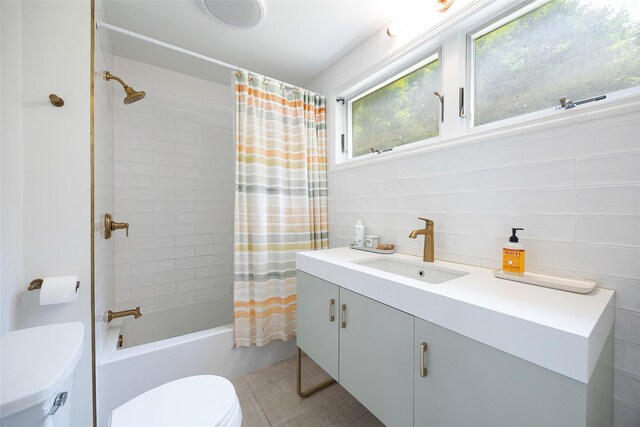 22 Tompkins Ave, Beacon, NY 12508 - bathroom featuring vanity, shower / tub combo with curtain, tile patterned flooring, and tile walls