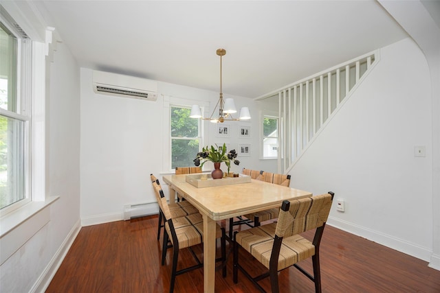 22 Tompkins Ave, Beacon, NY 12508 - dining area with an AC wall unit, a chandelier, wood finished floors, stairs, and a baseboard heating unit