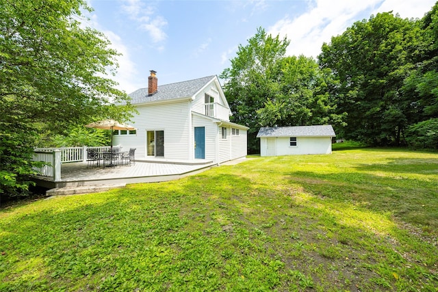 22 Tompkins Ave, Beacon, NY 12508 - back of house with a chimney, an outbuilding, a yard, and a wooden deck