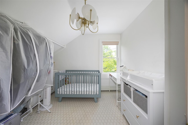 22 Tompkins Ave, Beacon, NY 12508 - bedroom featuring lofted ceiling, a chandelier, and a nursery area