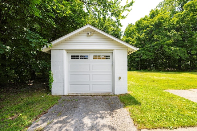 22 Tompkins Ave, Beacon, NY 12508 - detached garage featuring asphalt driveway