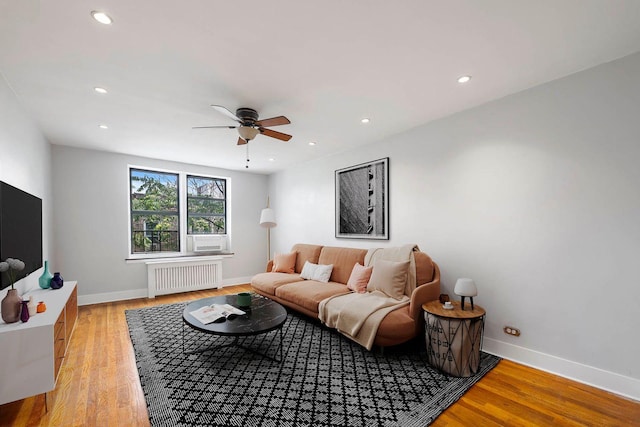 2420 Morris Ave Unit 6K, Bronx, NY 10468 - living area with radiator, a ceiling fan, light wood finished floors, and recessed lighting