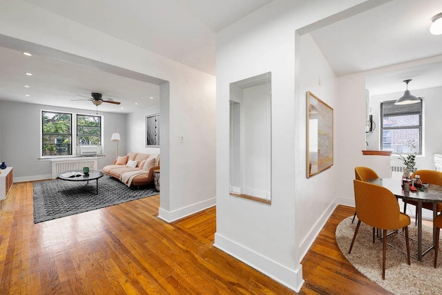 2420 Morris Ave Unit 6K, Bronx, NY 10468 - living area featuring radiator heating unit, wood finished floors, a ceiling fan, and recessed lighting