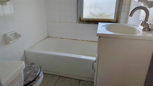 507 S 6th Ave, Mount Vernon, NY 10550 - bathroom with tile walls, a bath, vanity, and tile patterned floors
