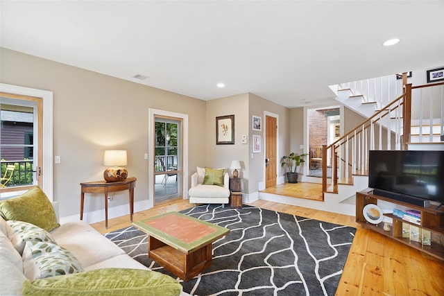 10 King St, Croton-On-Hudson, NY 10520 - living area with wood finished floors, stairway, and recessed lighting