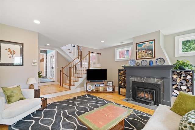 10 King St, Croton-On-Hudson, NY 10520 - living room featuring wood finished floors, healthy amount of natural light, stairway, recessed lighting, and a high end fireplace