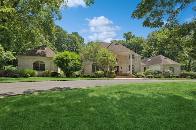 9 Swan Pl, Nissequogue, NY 11780 - view of front of home with a front yard
