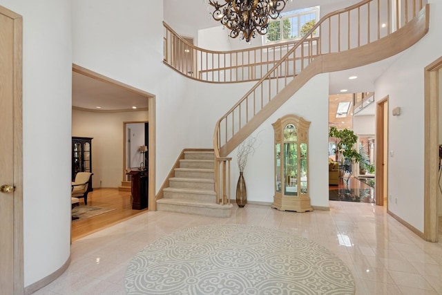 9 Swan Pl, Nissequogue, NY 11780 - tiled foyer entrance with a high ceiling, a chandelier, stairs, and recessed lighting