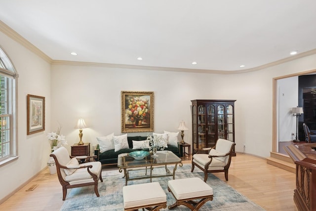 9 Swan Pl, Nissequogue, NY 11780 - living room featuring healthy amount of natural light, ornamental molding, recessed lighting, and light wood-style flooring