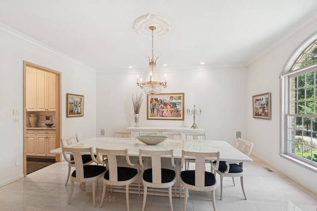 9 Swan Pl, Nissequogue, NY 11780 - dining area featuring healthy amount of natural light, a chandelier, ornamental molding, and recessed lighting