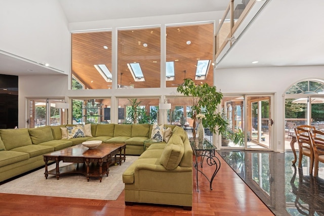 9 Swan Pl, Nissequogue, NY 11780 - living area with a high ceiling, a skylight, wood finished floors, and recessed lighting