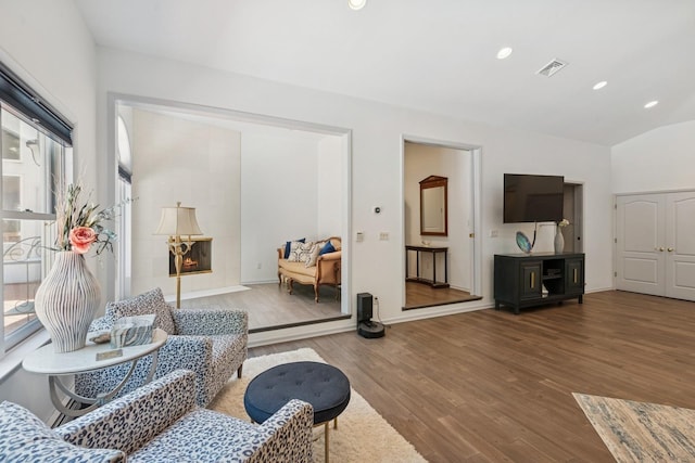 9 Swan Pl, Nissequogue, NY 11780 - living room with wood finished floors, lofted ceiling, and recessed lighting
