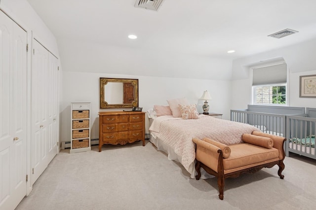 9 Swan Pl, Nissequogue, NY 11780 - bedroom with light colored carpet, lofted ceiling, recessed lighting, and a baseboard heating unit