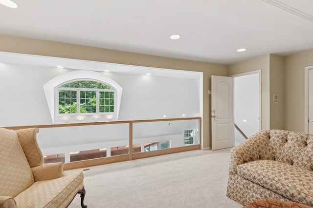 9 Swan Pl, Nissequogue, NY 11780 - living area featuring carpet floors, an upstairs landing, and recessed lighting