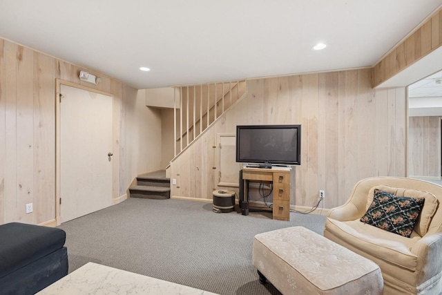 9 Swan Pl, Nissequogue, NY 11780 - living room with stairway, wood walls, carpet flooring, and recessed lighting