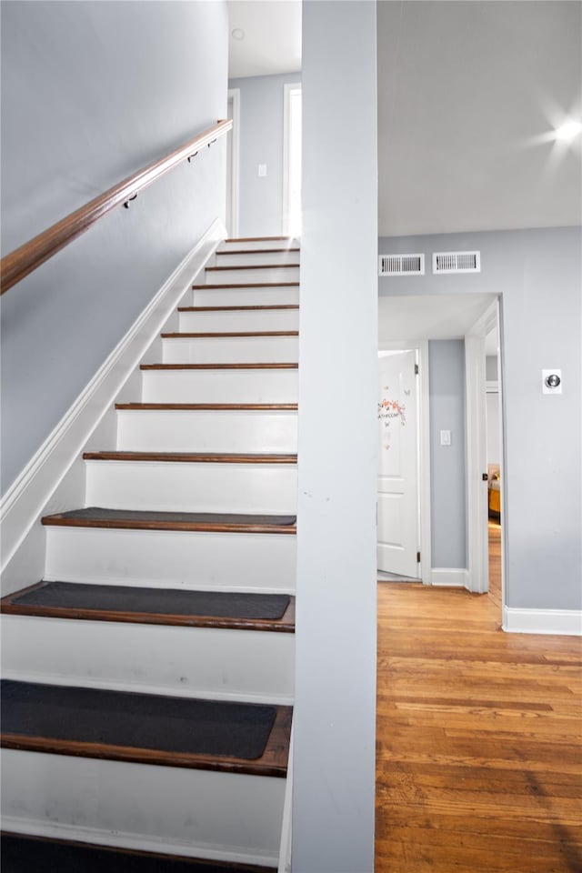 550 Armond St, Uniondale, NY 11553 - stairs featuring wood finished floors and baseboards