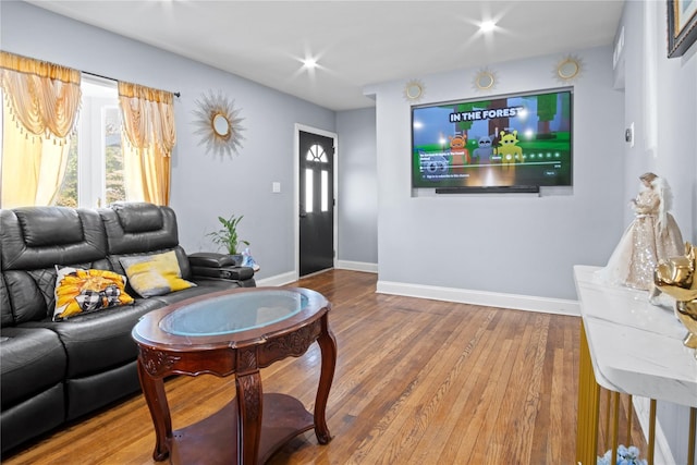 550 Armond St, Uniondale, NY 11553 - living area featuring wood finished floors and baseboards
