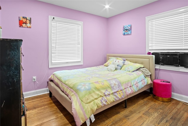 550 Armond St, Uniondale, NY 11553 - bedroom with wood finished floors and cooling unit
