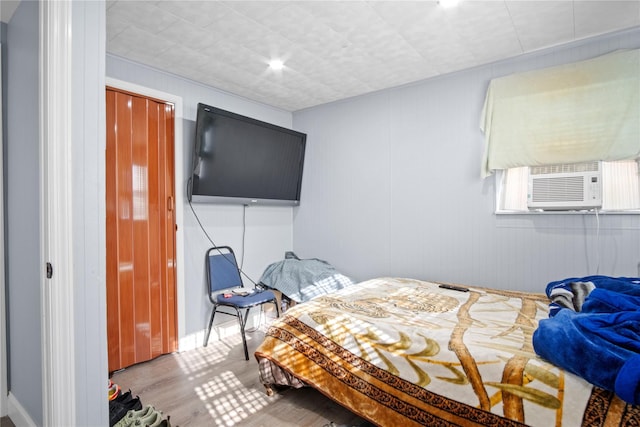 550 Armond St, Uniondale, NY 11553 - bedroom with cooling unit and wood finished floors