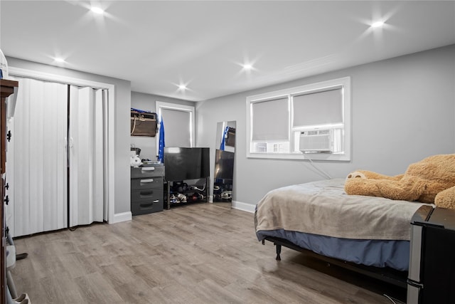 550 Armond St, Uniondale, NY 11553 - bedroom featuring cooling unit, recessed lighting, and wood finished floors