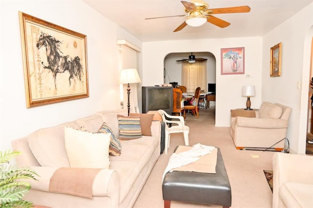 3331 Hone Ave, Bronx, NY 10469 - carpeted living room with a ceiling fan and arched walkways