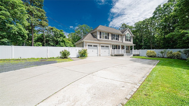5 Ormond Pl, Mastic, NY 11950 - view of front of home with covered porch, concrete driveway, and a garage