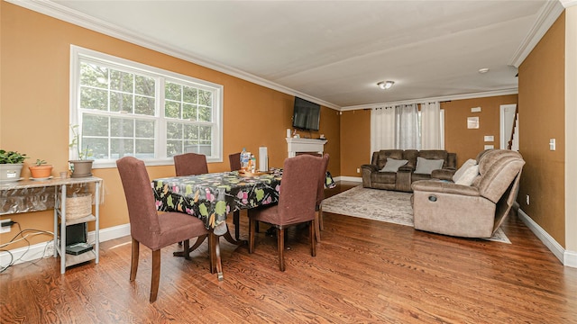 5 Ormond Pl, Mastic, NY 11950 - dining space with wood finished floors, ornamental molding, and a fireplace