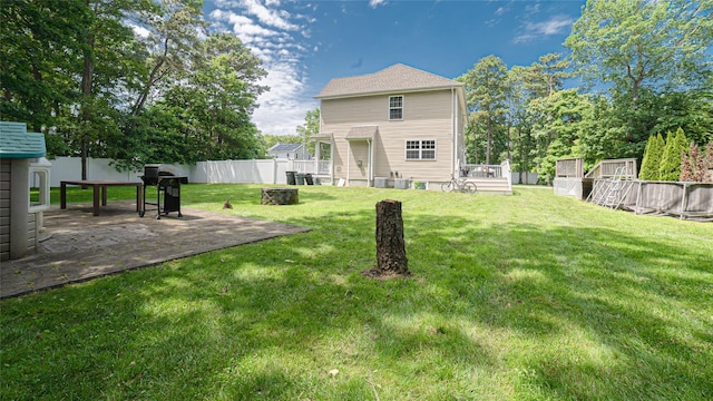 5 Ormond Pl, Mastic, NY 11950 - back of house with a fenced backyard and a patio area