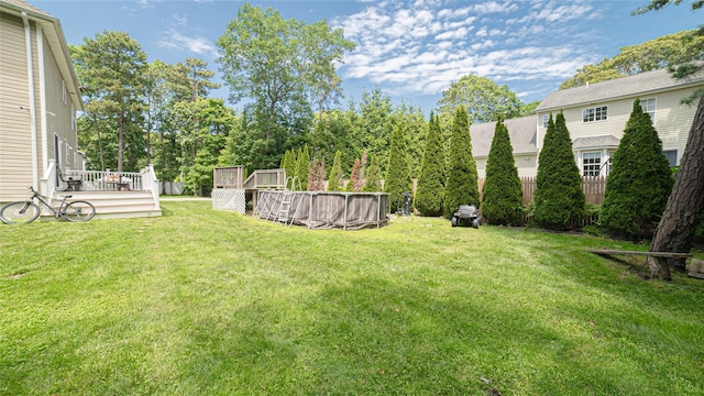 5 Ormond Pl, Mastic, NY 11950 - view of grassy yard with a wooden deck and an outdoor pool