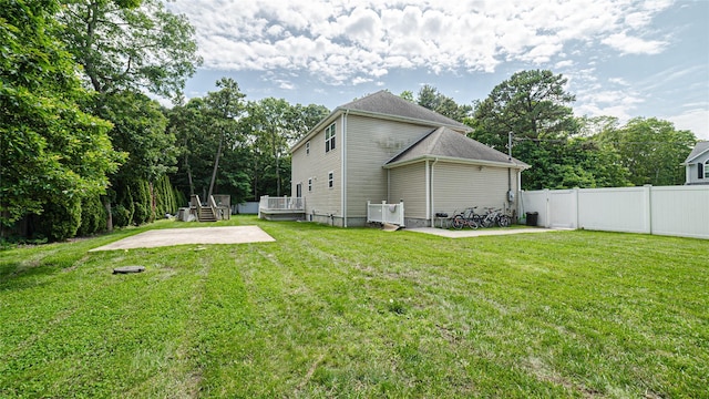 5 Ormond Pl, Mastic, NY 11950 - rear view of property featuring a patio area, a deck, and view of wooded area