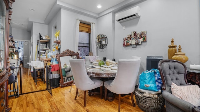 1050 Morris Ave, Bronx, NY 10456 - dining space featuring a wall mounted AC, wood finished floors, and recessed lighting