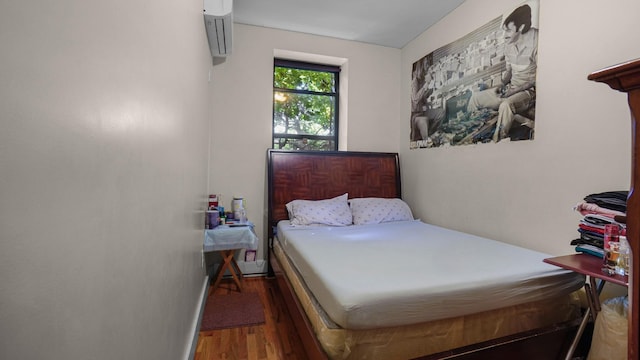 1050 Morris Ave, Bronx, NY 10456 - bedroom with wood finished floors and a wall unit AC