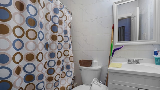 1050 Morris Ave, Bronx, NY 10456 - full bathroom with tile walls, vanity, a shower with shower curtain, and decorative backsplash