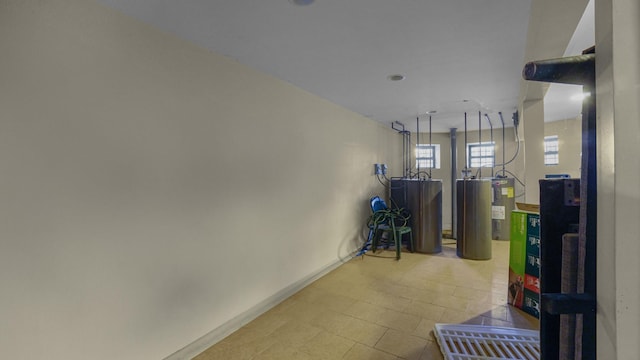 1050 Morris Ave, Bronx, NY 10456 - hallway featuring water heater and baseboards
