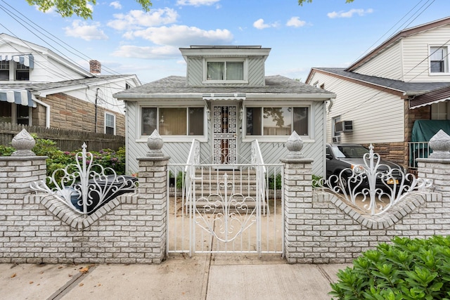 1160 E 89th St, Brooklyn, NY 11236 - bungalow-style house with a fenced front yard, roof with shingles, and a gate