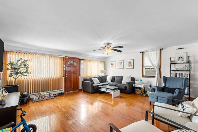 1160 E 89th St, Brooklyn, NY 11236 - living area with a ceiling fan, baseboard heating, and wood finished floors