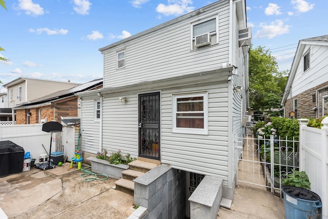 1160 E 89th St, Brooklyn, NY 11236 - back of house featuring entry steps, a patio, and cooling unit