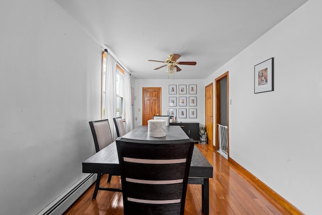 1160 E 89th St, Brooklyn, NY 11236 - dining room with hardwood / wood-style flooring, ceiling fan, and a baseboard heating unit