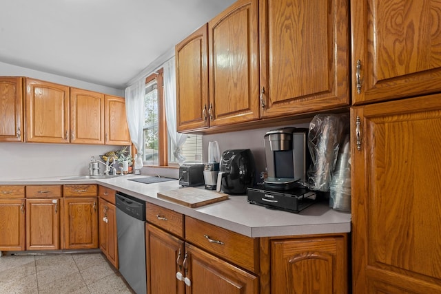 1160 E 89th St, Brooklyn, NY 11236 - kitchen featuring stainless steel dishwasher, light countertops, and brown cabinetry