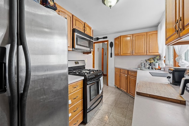 1160 E 89th St, Brooklyn, NY 11236 - kitchen with appliances with stainless steel finishes, light countertops, and granite tiled floors